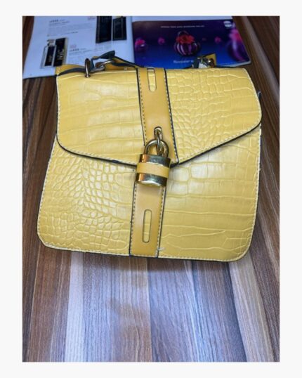 Small sized yellow croc padlock bag
