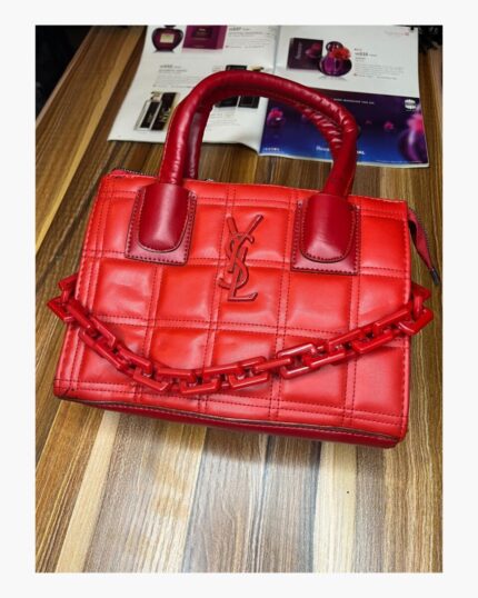 Red YSL medium sized bag with rubber chain across